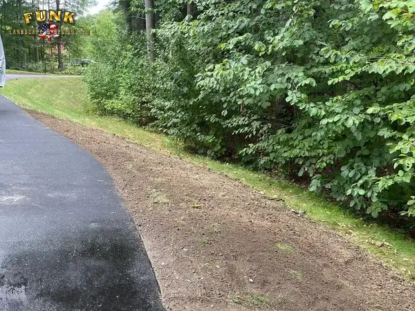 Drainage stone border in Webster, MA by Funk Landscape & Design