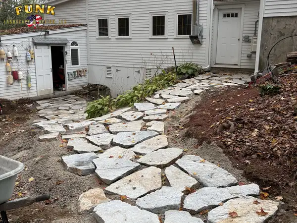 Natural flagstone path beside the house