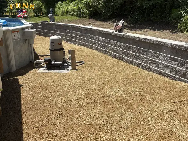 Retaining wall and compacted gravel terrace during construction