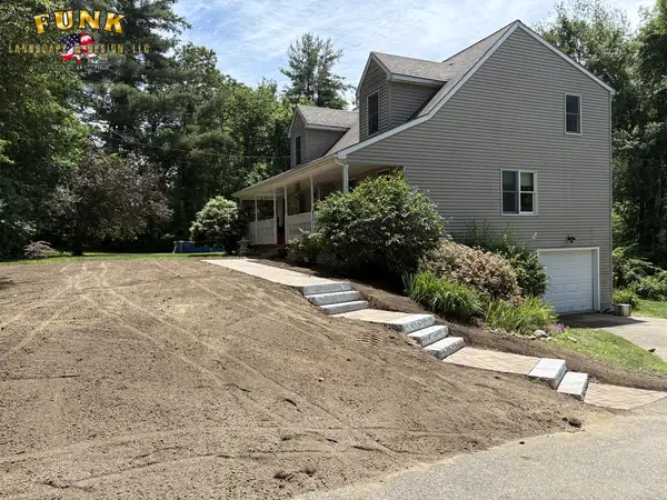 Finished granite steps and walkway climbing the front slope