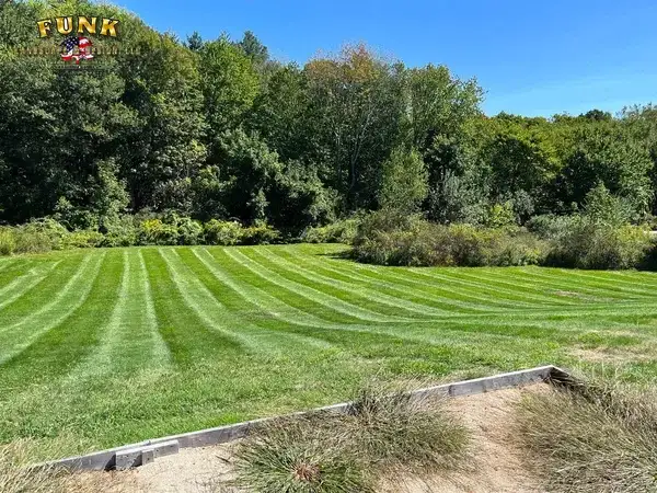 Lawn mowing in Worcester, MA by Funk Landscape & Design