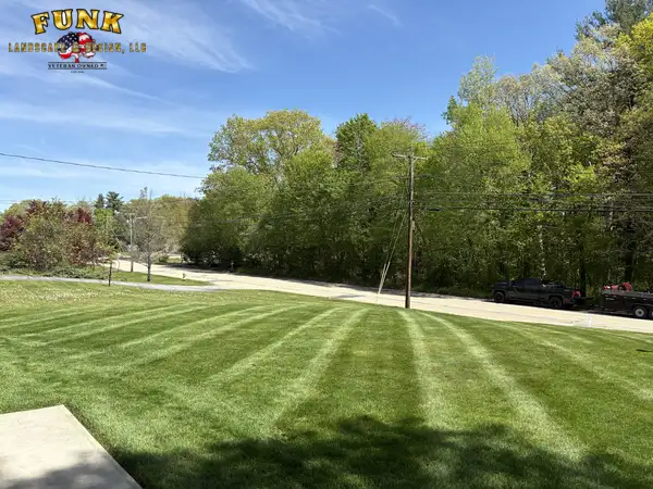 Expansive freshly striped lawn along a roadside